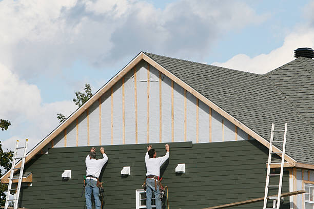 Professional Storm Damage Siding Repair technician working in Manchester, CT